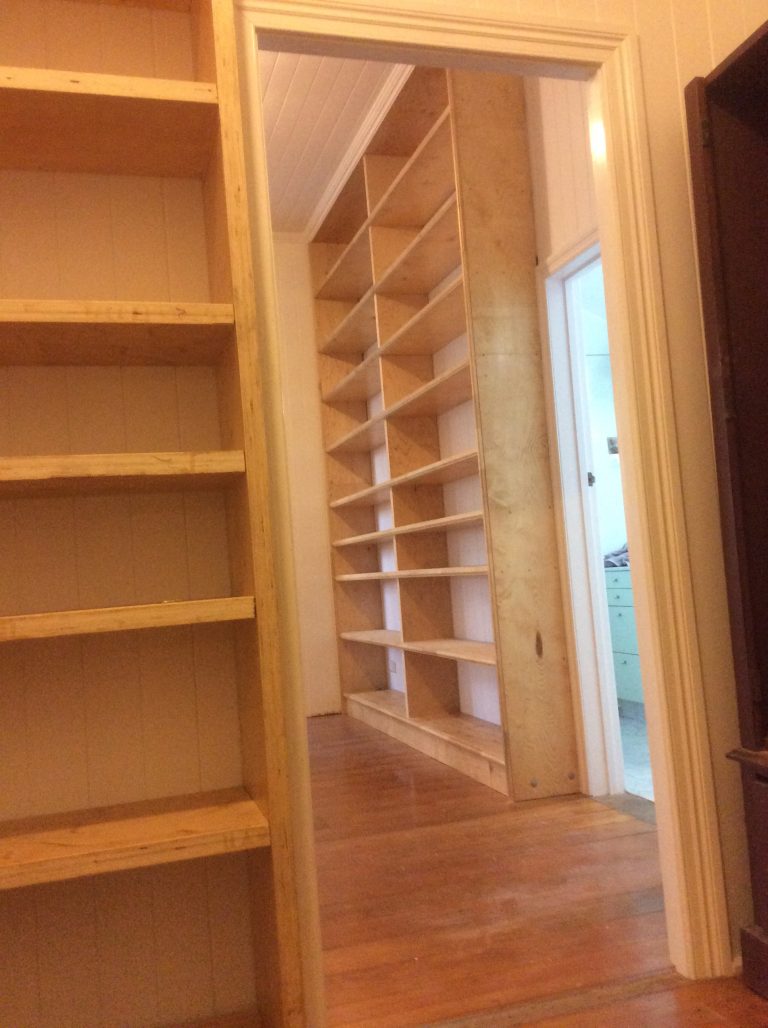 floor to ceiling LVL shelves and gables steel beam under plinth for weight distribution